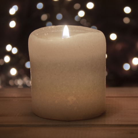 old candle on a wooden table